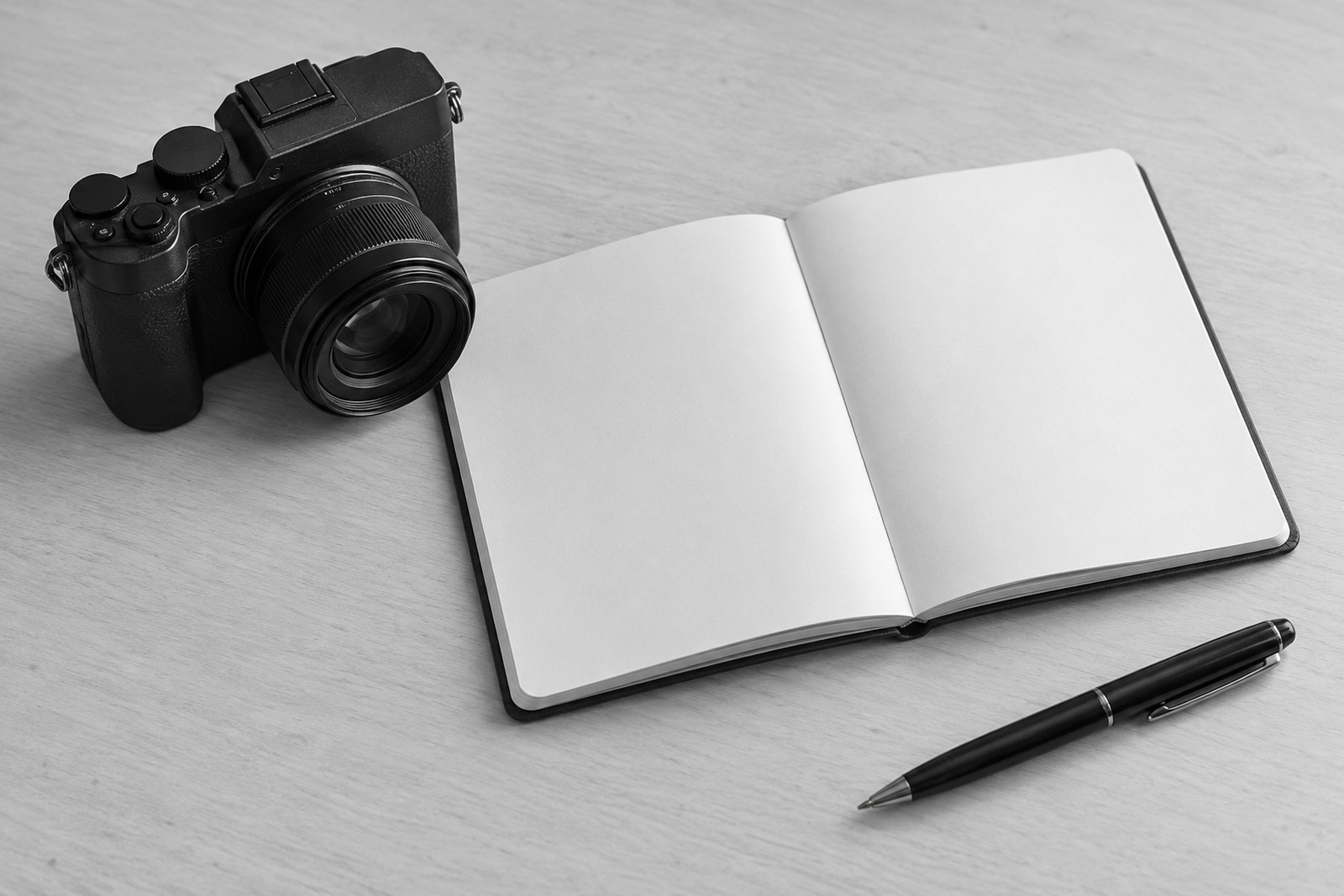Camera and blank research notes on a desk.